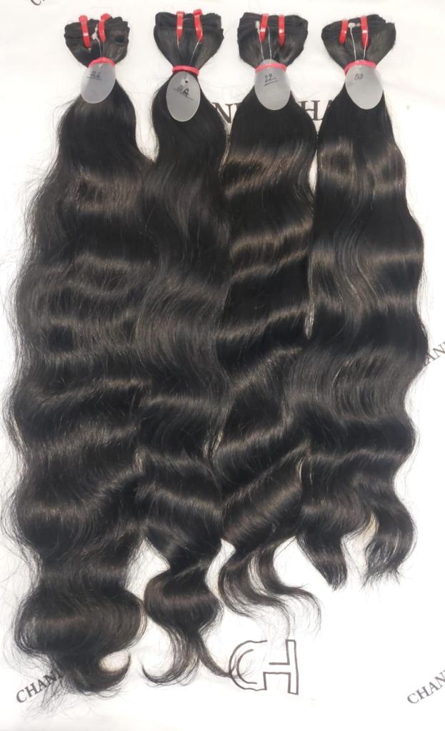 Jet black raw South Indian natural wavy weft bundles, sold by the bundle