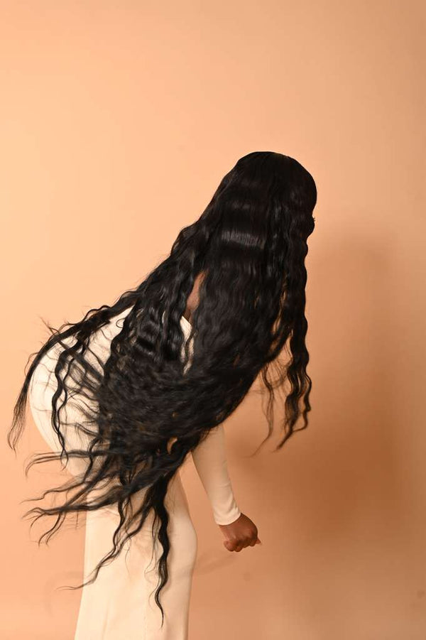 Long loose curly South Indian raw hair, back view showing length