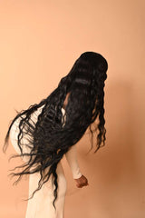 Long loose curly South Indian raw hair, back view showing length