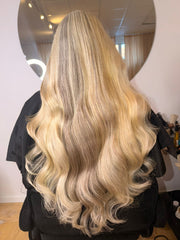 Client wearing 10A double drawn genius weft in blond #27