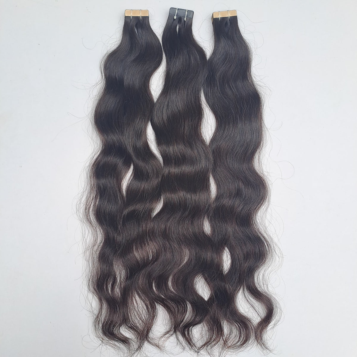 Raw South Indian natural wave tape-in extensions, alternate photo