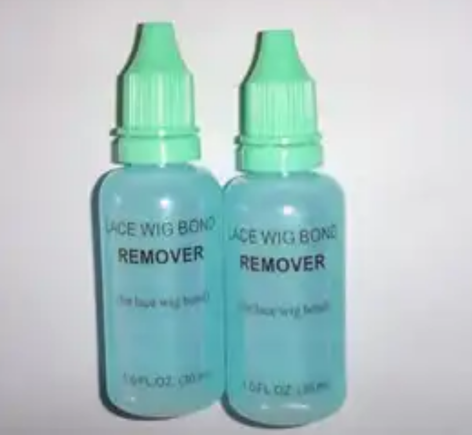 Bottles of glue and tape remover for hair extensions