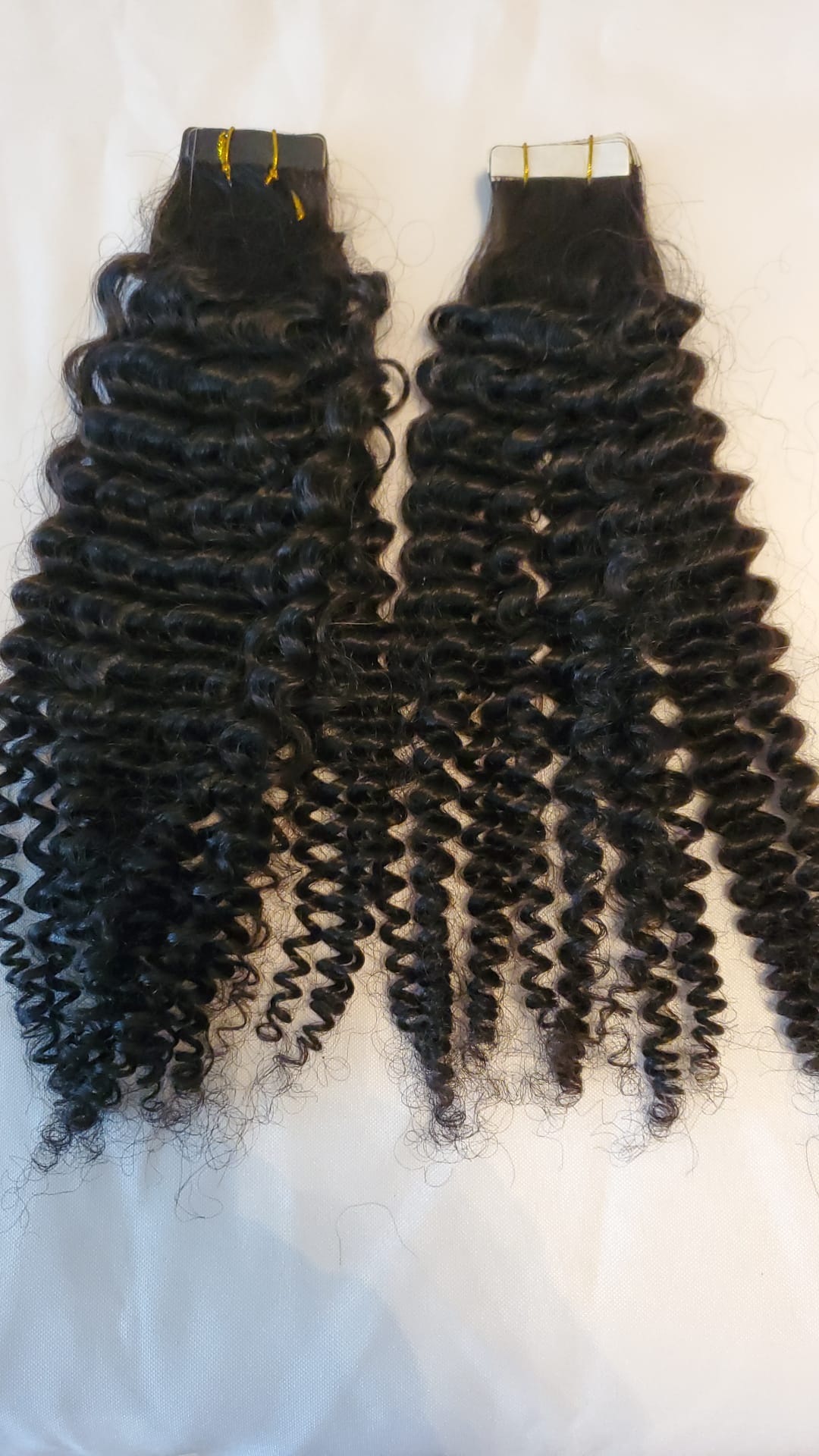Kinky curly 10A virgin hair tape-in extensions on clearance
