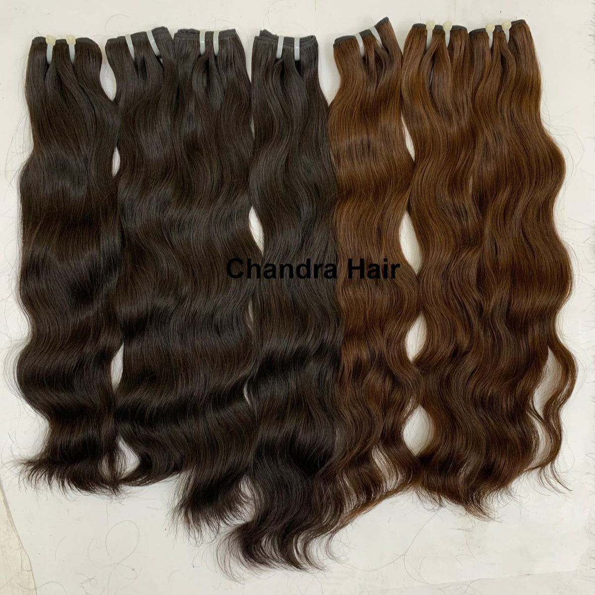 Light brown raw North Indian natural wavy weft bundles, sold by the bundle