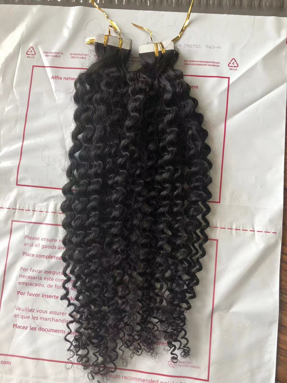 Kinky curly 10A virgin hair tape-ins, another angle