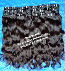 Chandra Hair North Indian raw hair bundles with natural waves on blue background ready to buy North Indian raw hair online
